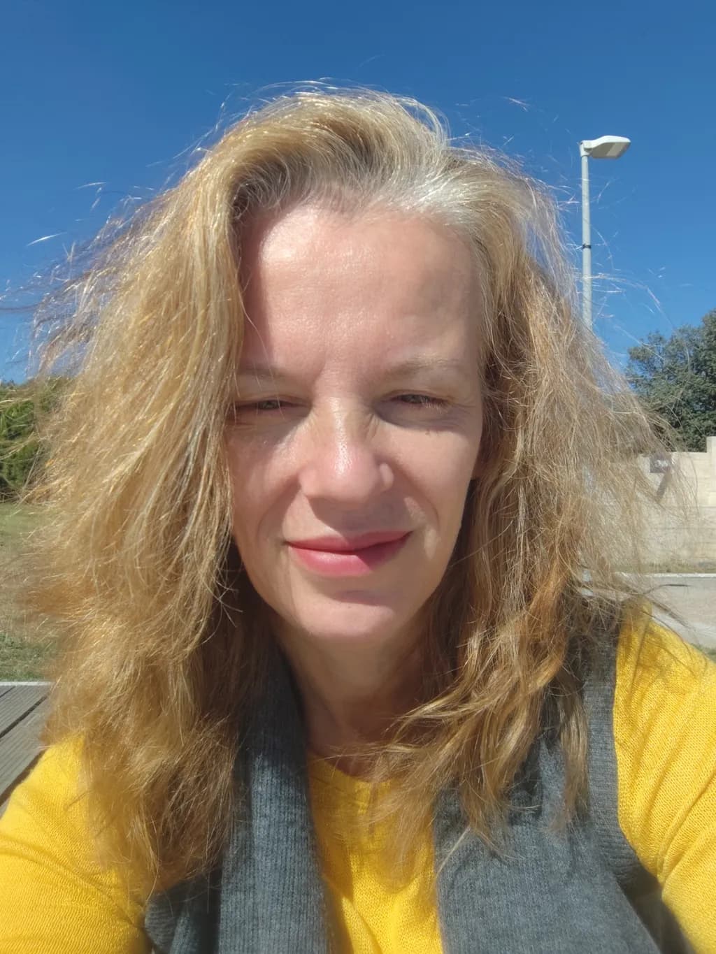 Sunlit Smiles: A Portrait of Joy in Nature's Embrace