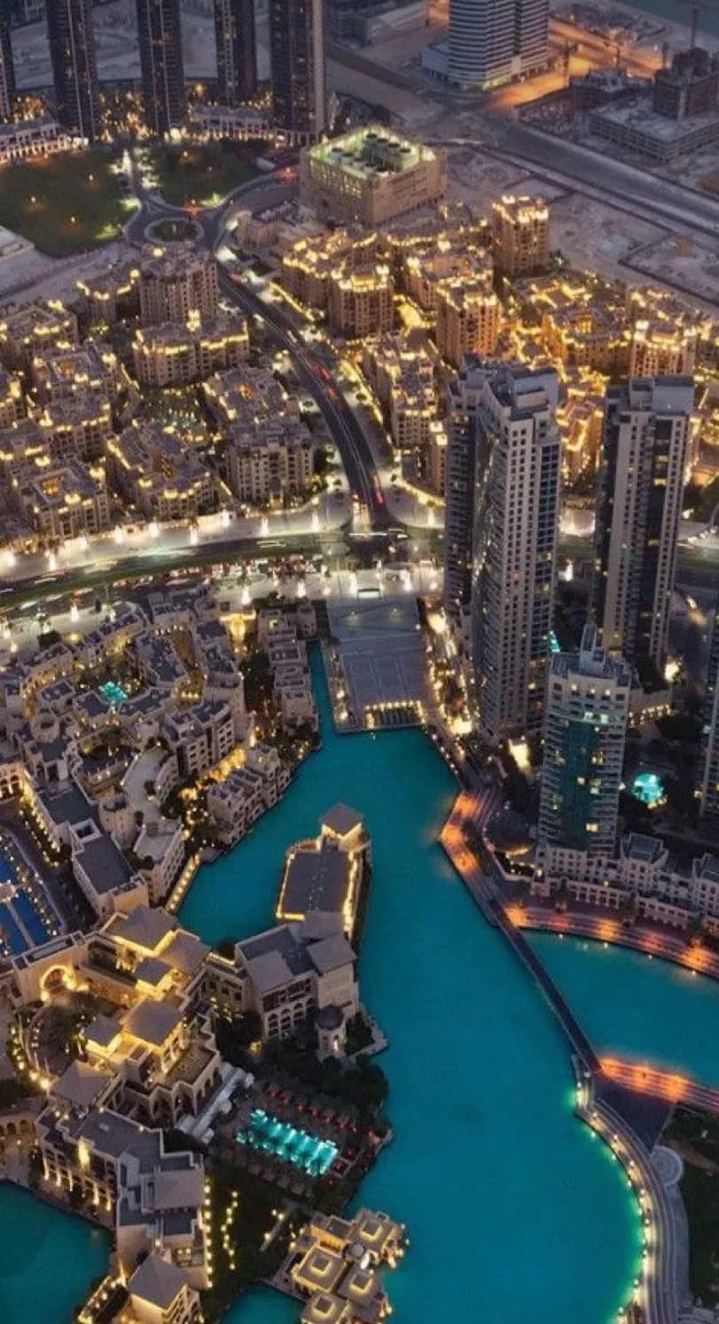 Urban Night Symphony: A Captivating Cityscape of Lights and Water
