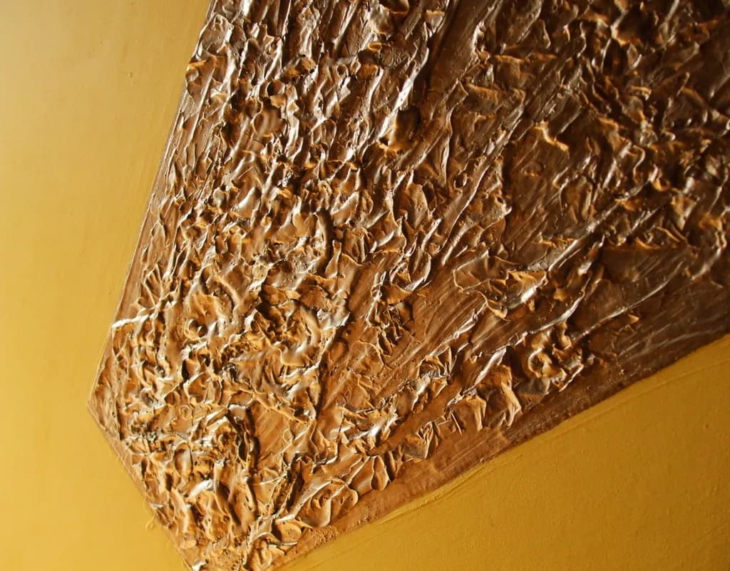 Textured Harmony: A Golden Embrace of Light and Shadow in Abstract Form