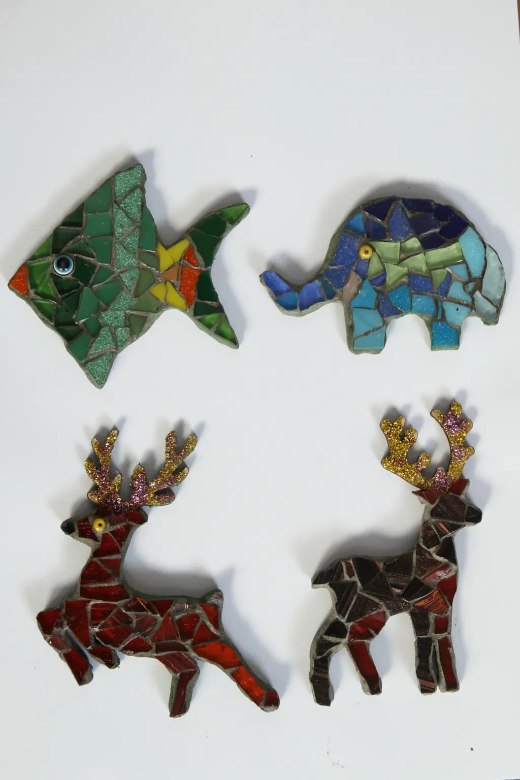 Whimsical Mosaic Menagerie: Colorful Fish, Elephant, and Reindeer Art Pieces