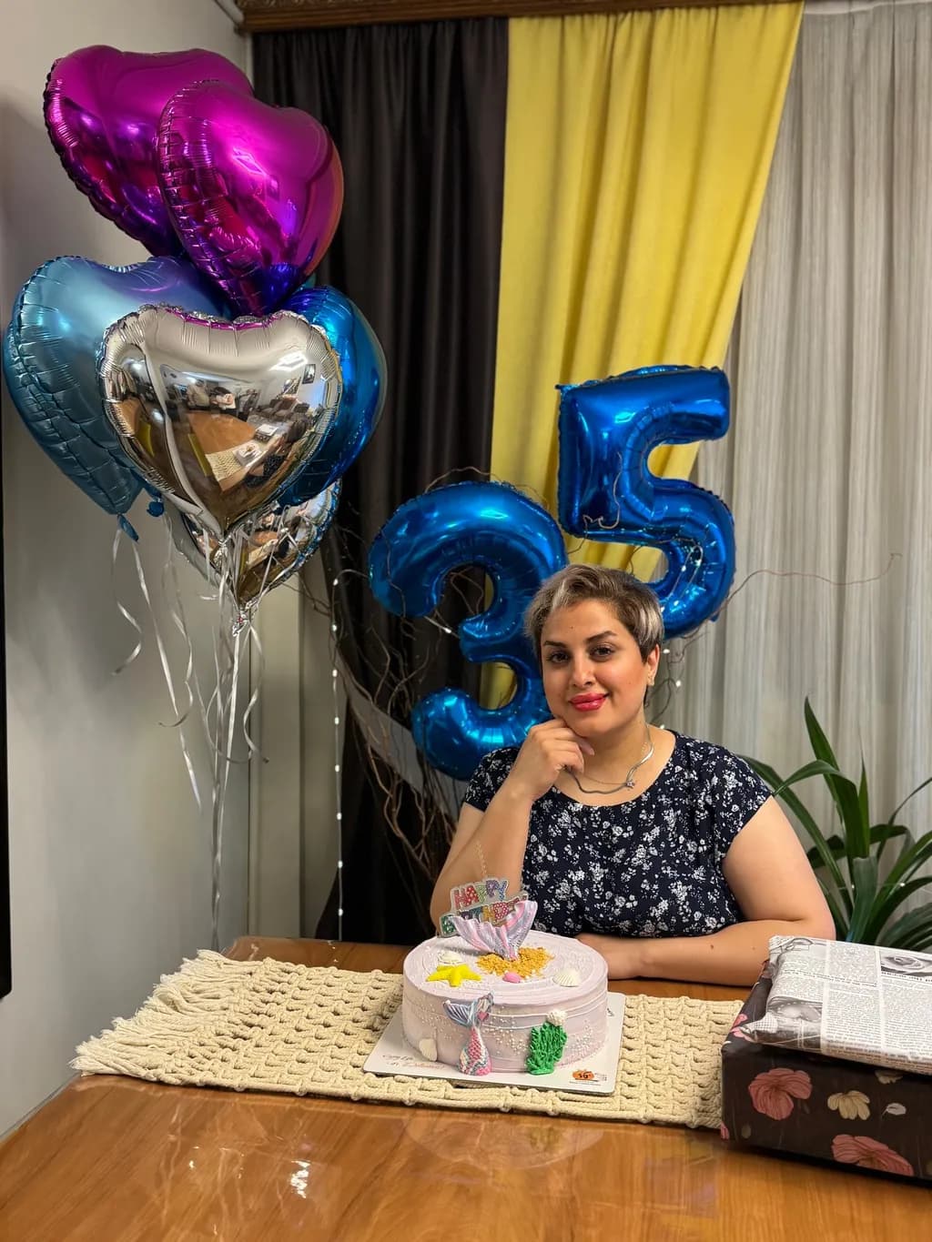 Celebrating 35: A Joyful Birthday Moment with Cake and Balloons