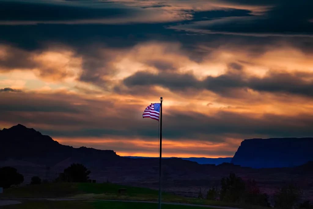 Whispers of Freedom: A Flag Against the Twilight Sky