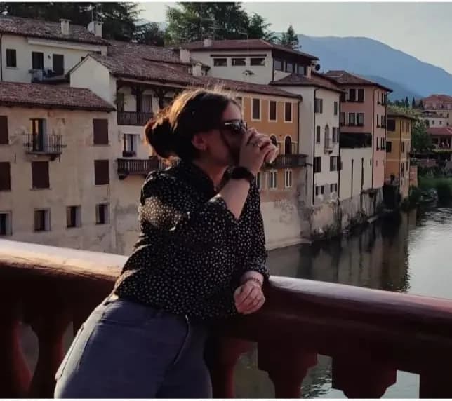 Serenity by the Water: A Moment of Reflection in a Picturesque Italian Village