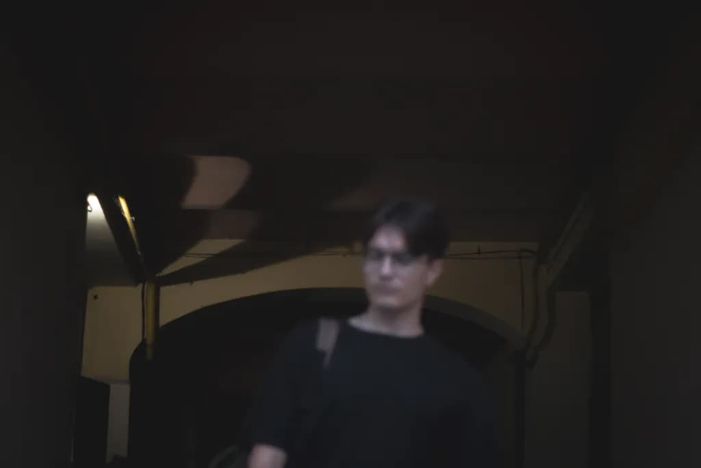 Urban Shadows: A Blurred Encounter in Light and Contrast