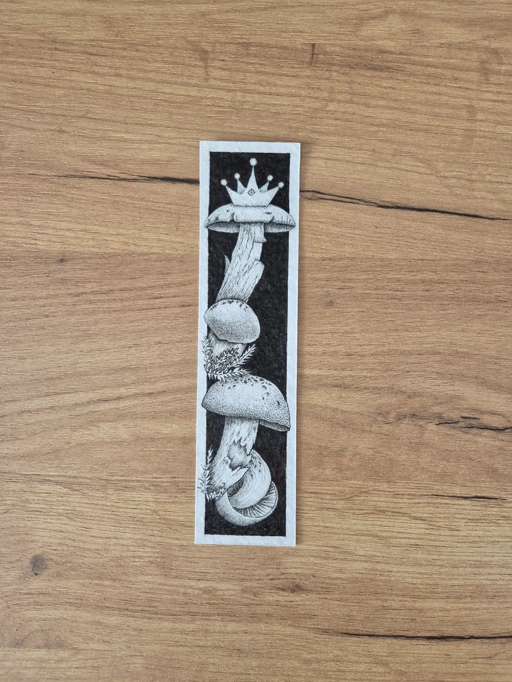 Whimsical Kingdom: A Black and White Mushroom Illustration with a Crown