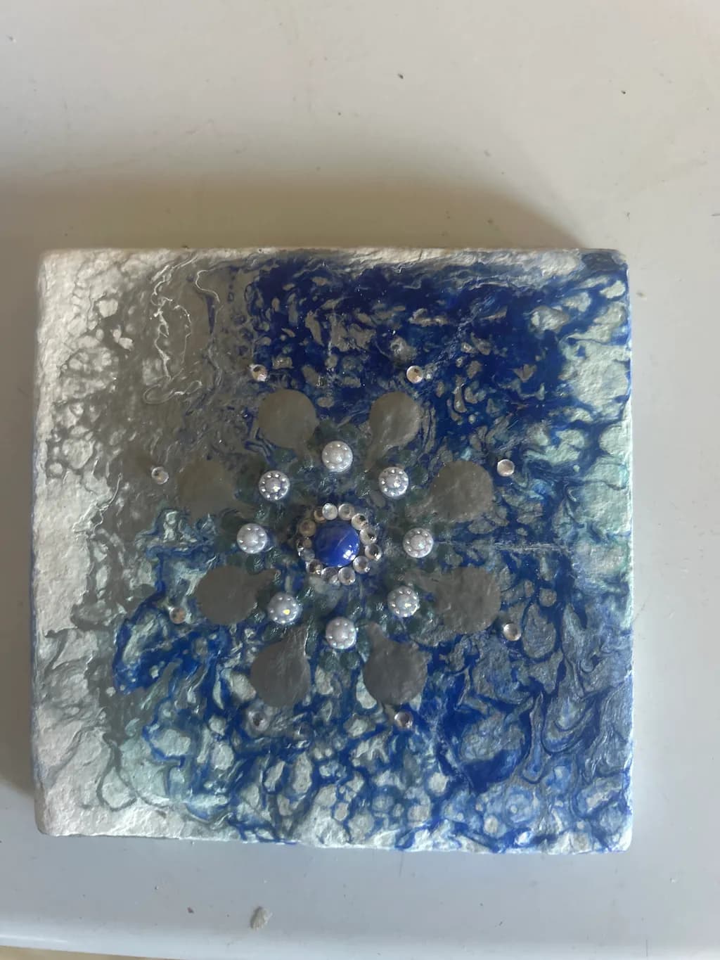 Whispers of Winter: A Textured Blue Snowflake Art Piece