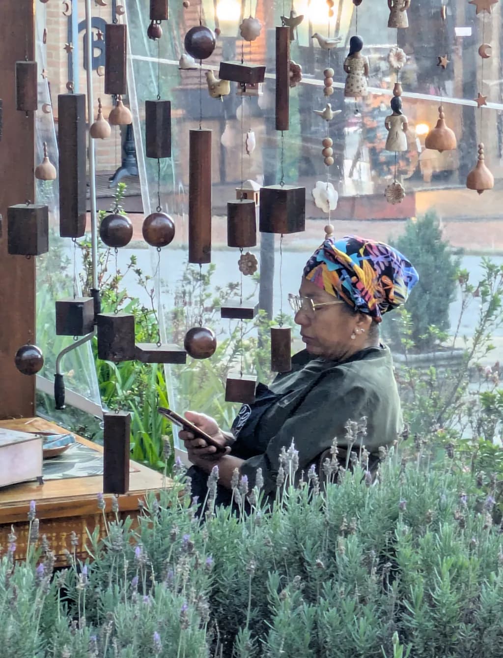 Woman in Garden with Windchimes