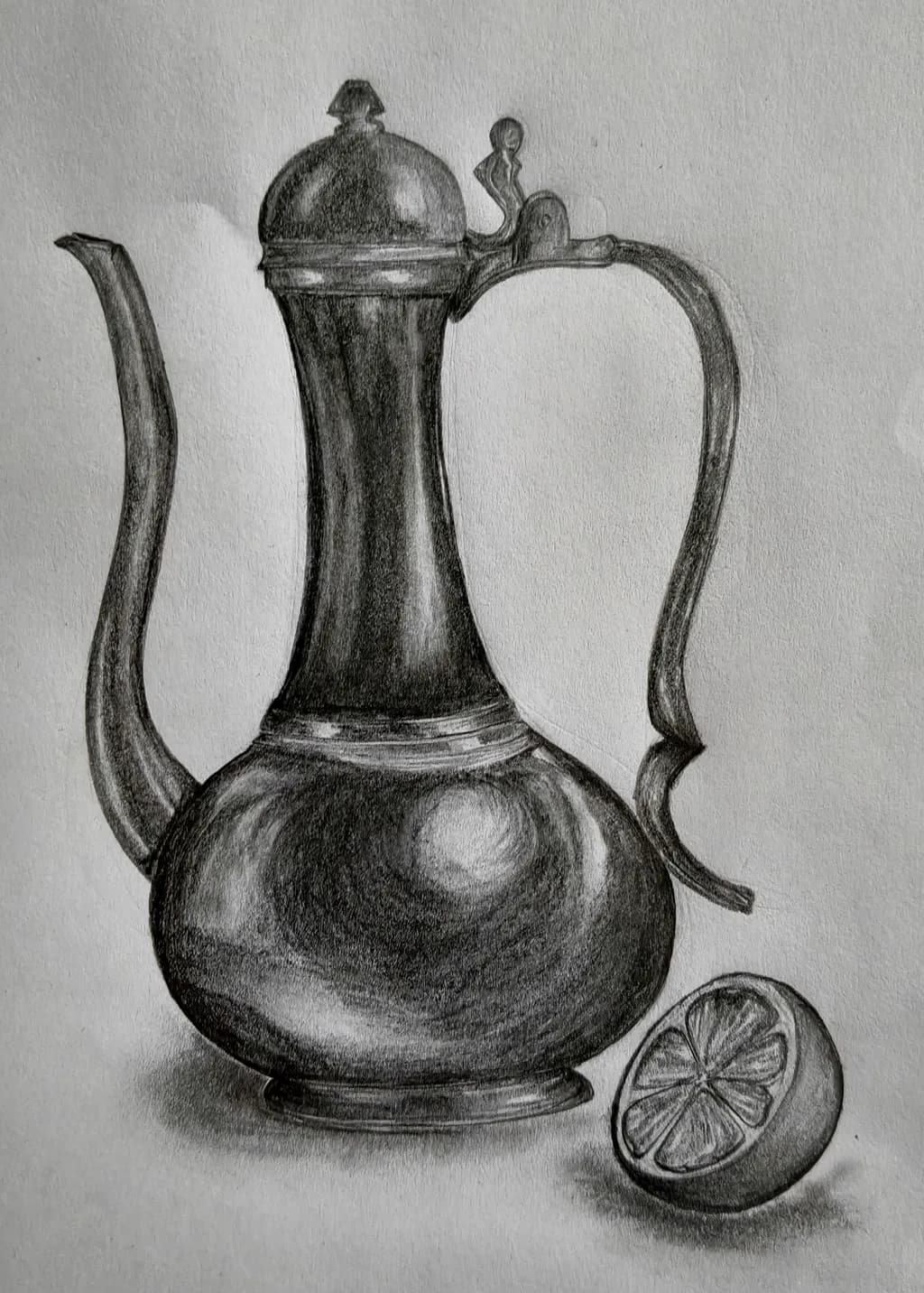 Elegant Teapot and Lemon
