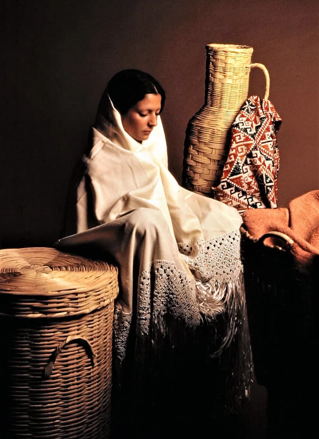 Woman Among Woven Forms