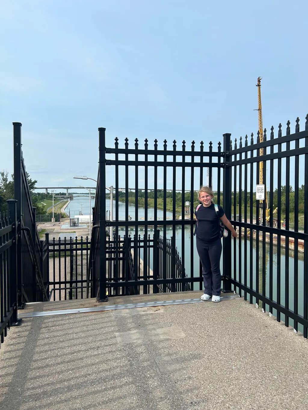 Girl by the Canal Fence