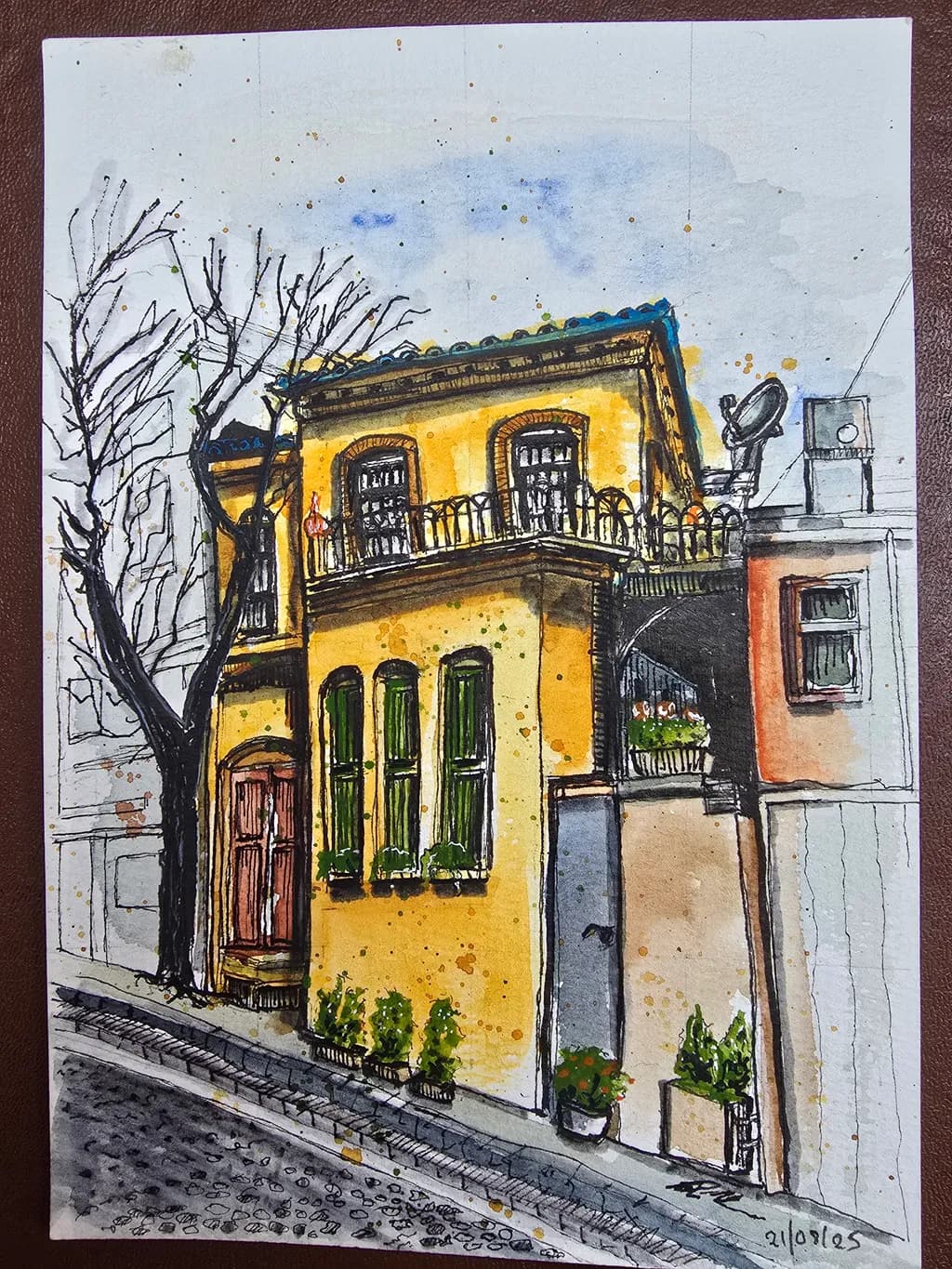 Yellow Facade on Sloped Street