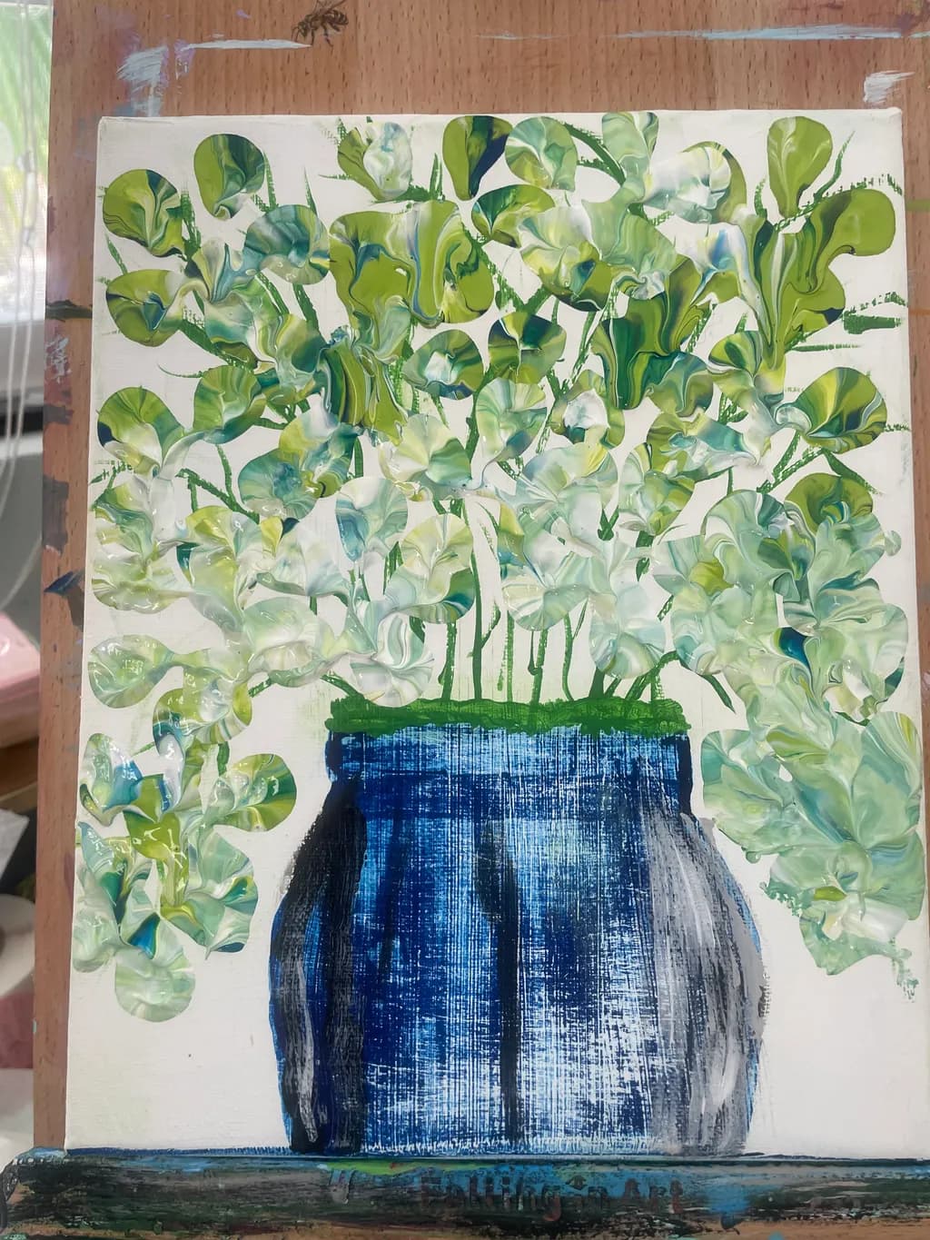 Green Foliage in Blue Vase