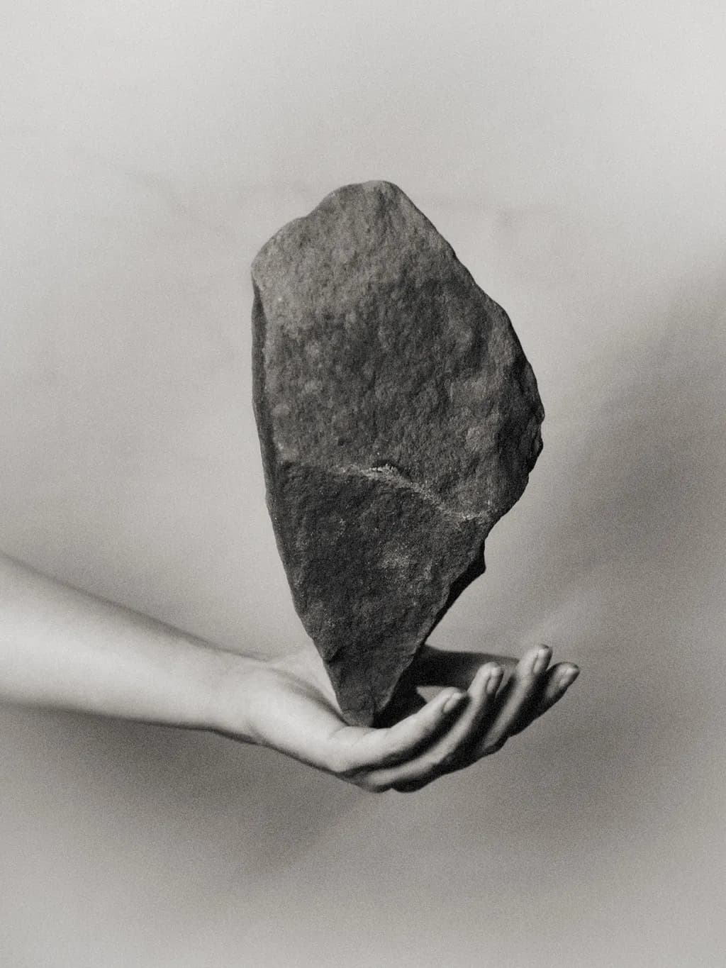 Hand Holding Stone