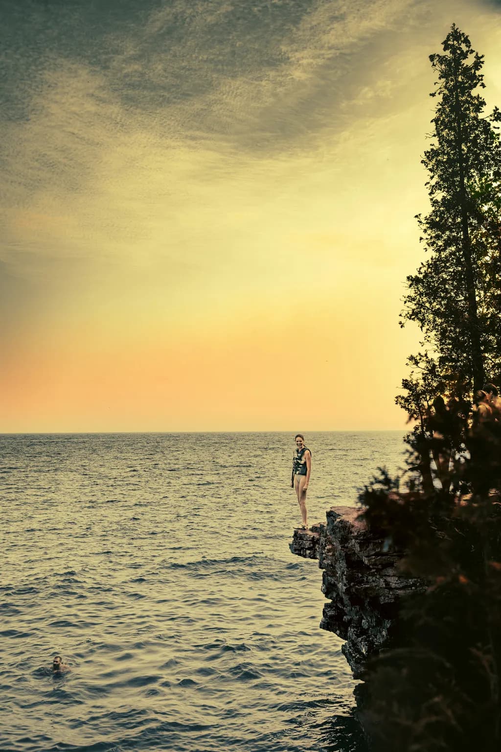 Girl on Cave Point Cliff 