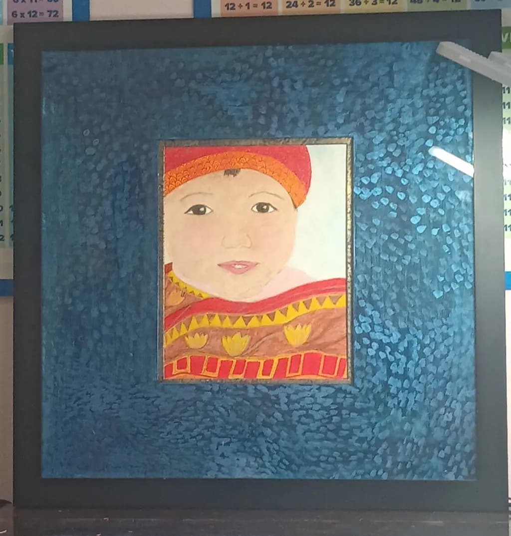 Child in Patterned Wrap