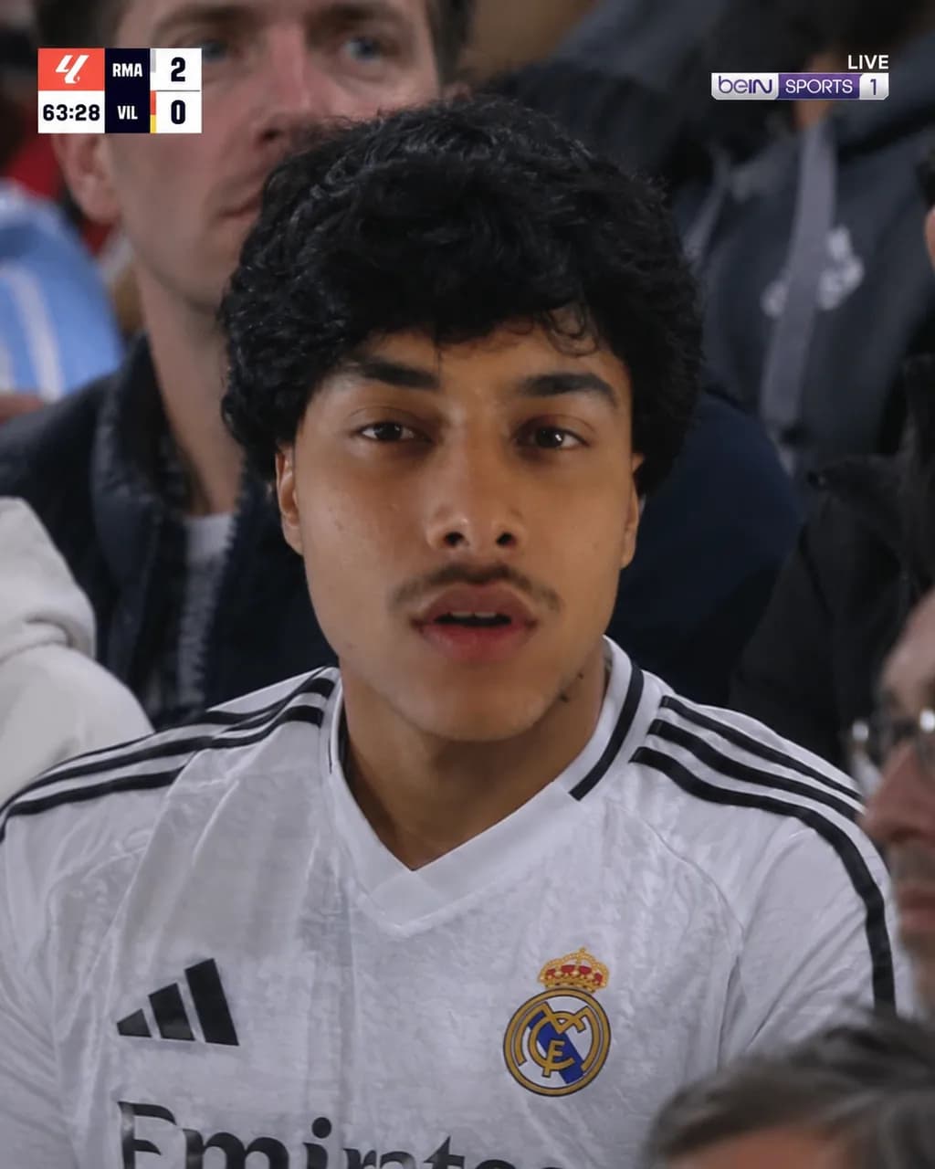 Focused Fan in Real Madrid Jersey