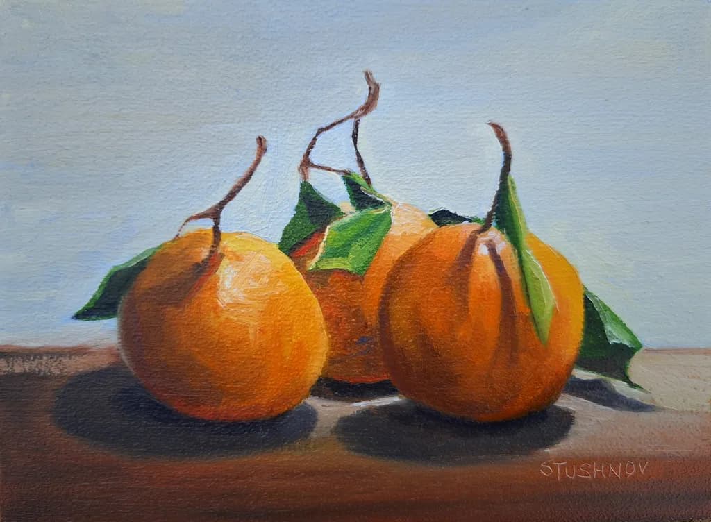 Three Oranges with Leaves