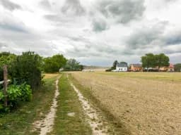 Country Path Under Storm Clouds