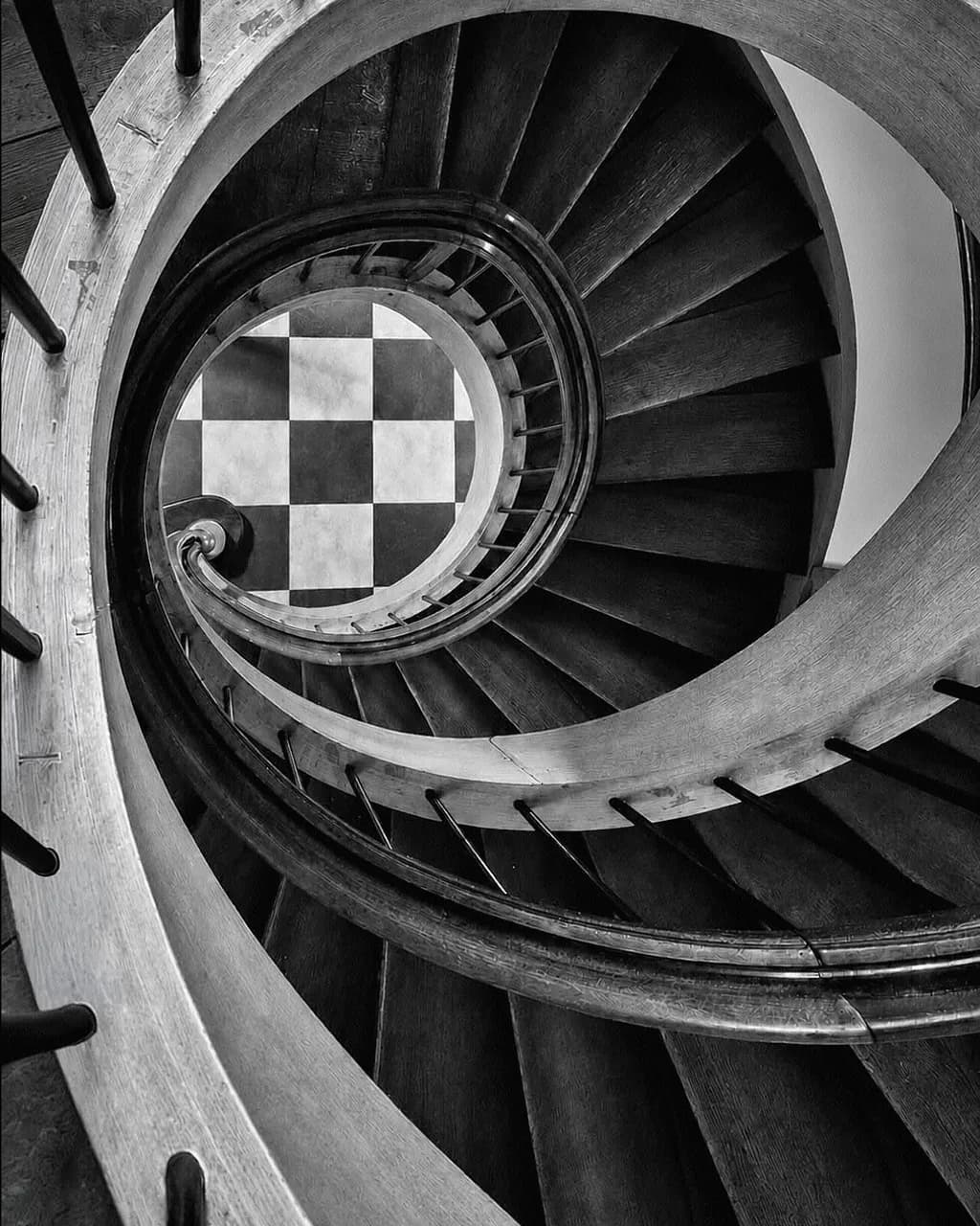 Spiral Staircase Meets Checkerboard Floor