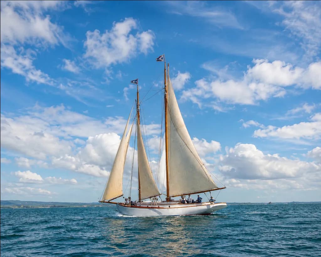 Billowing Memory: A Classic Schooner Crossing Calm Seas 