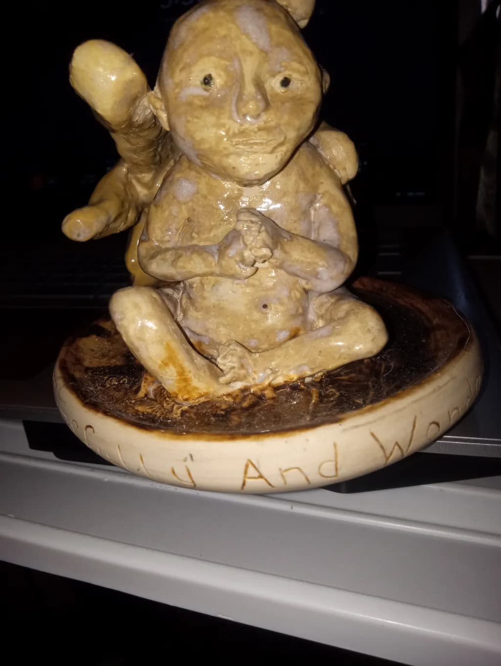 Contemplative Clay Figure