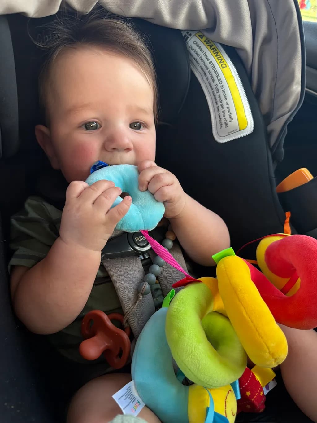 Baby with Colorful Toy Rings