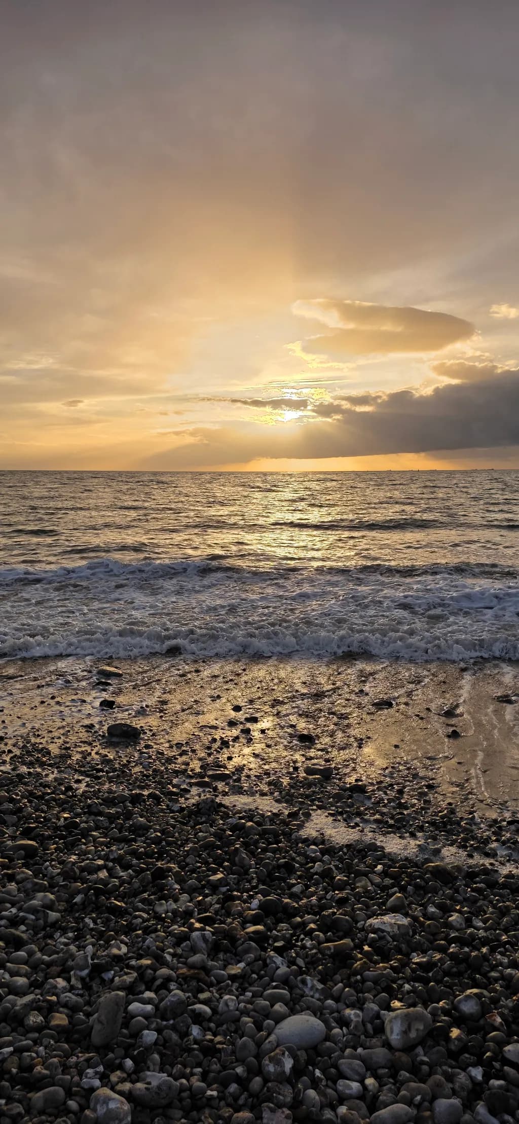 Sunset Over Rocky Shore