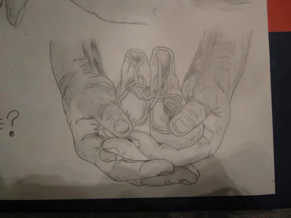 Hands Holding Shoes