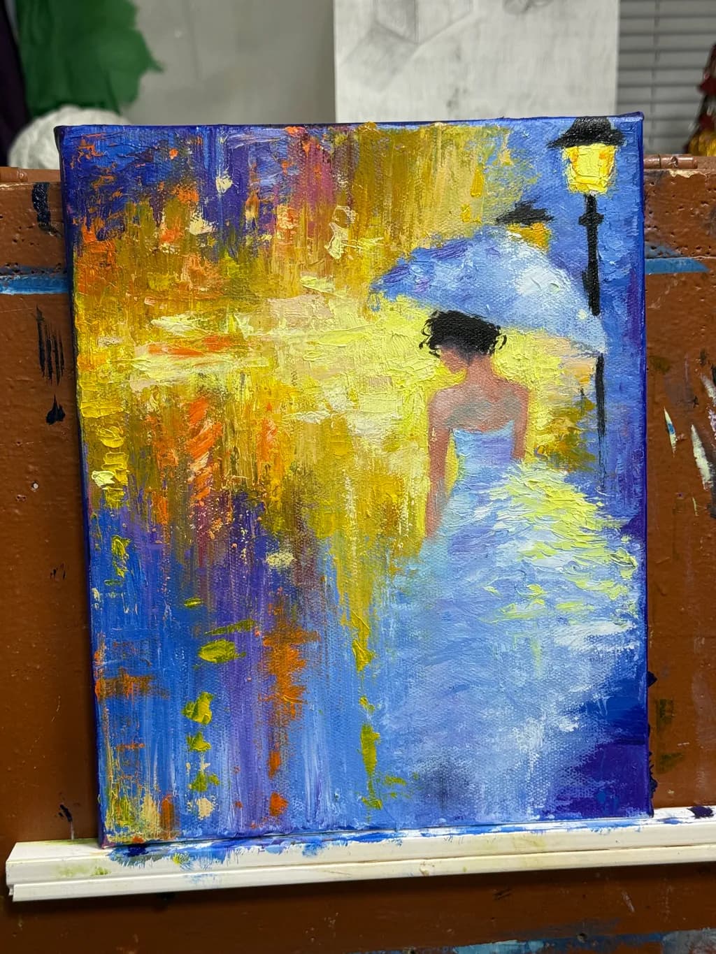 Woman with Umbrella by Street Lamp