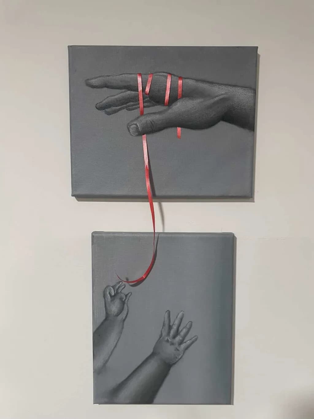 Hands with Red Ribbon