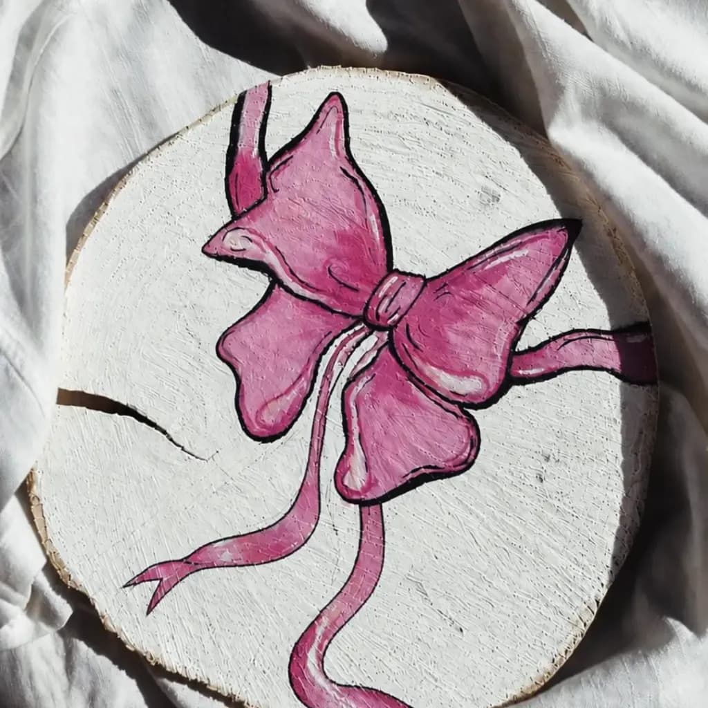 Pink Bow on Wood Slice