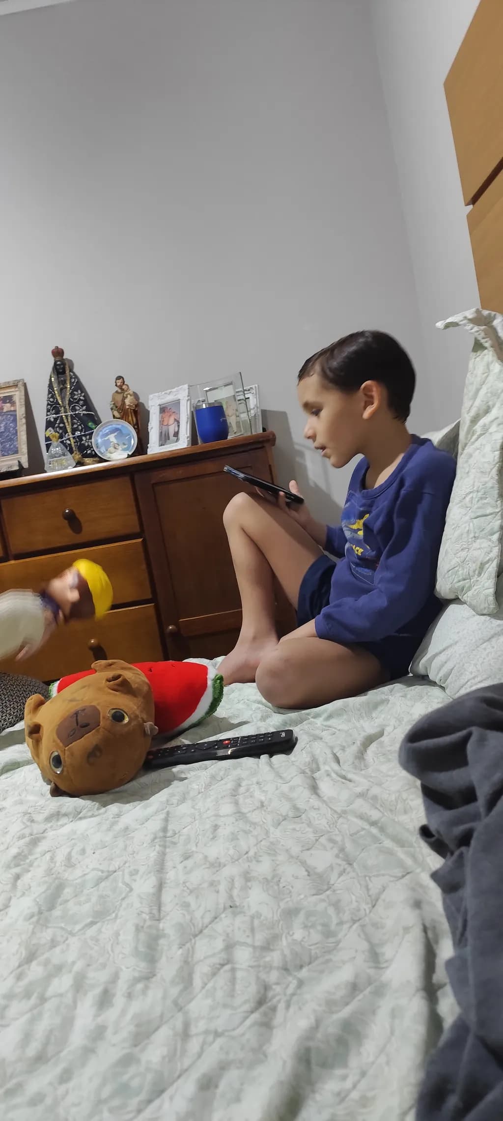 Child on Bed with Toys