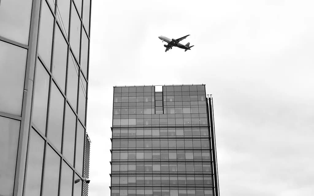 Airplane Over Building