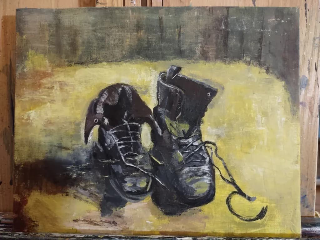 Worn Boots on Yellow Surface
