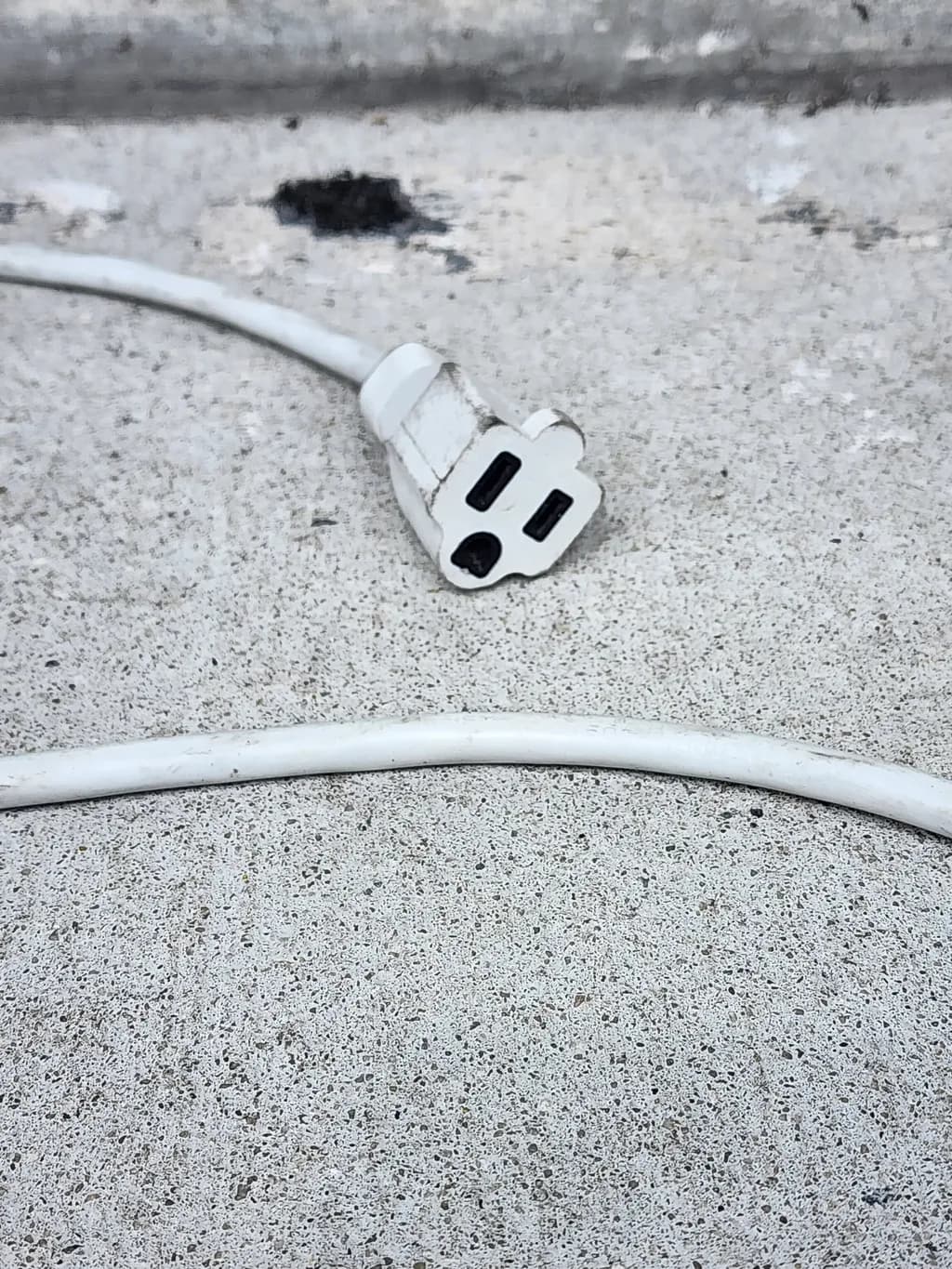 White Power Cord on Concrete