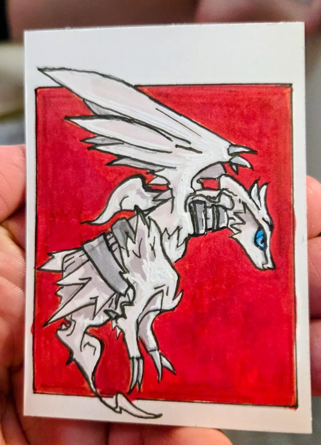 Winged Creature on Red Background