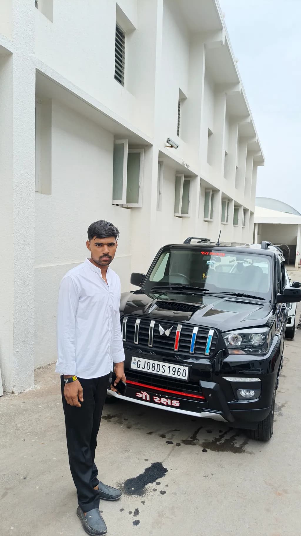 Man and Black SUV