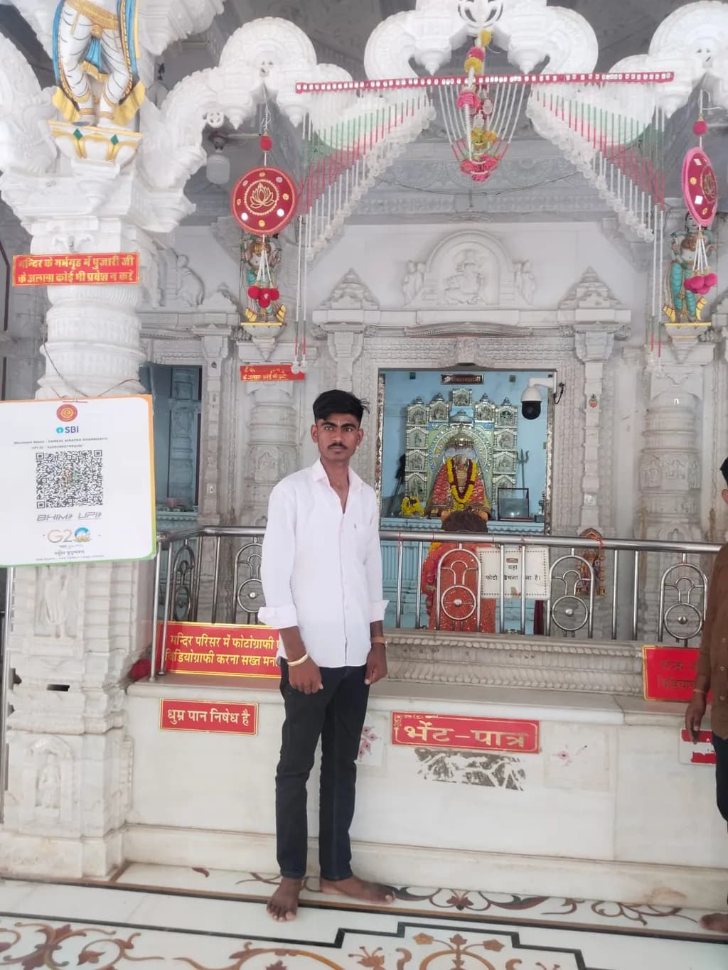 Temple Interior with Devotee