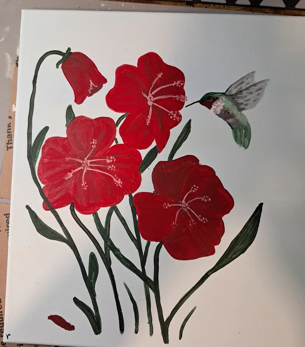 Hummingbird and Red Flowers