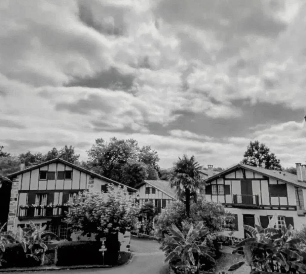 Village Houses Under Clouds