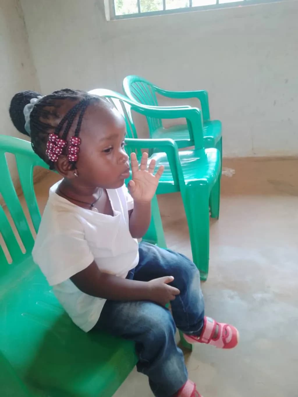 Child on Green Chair