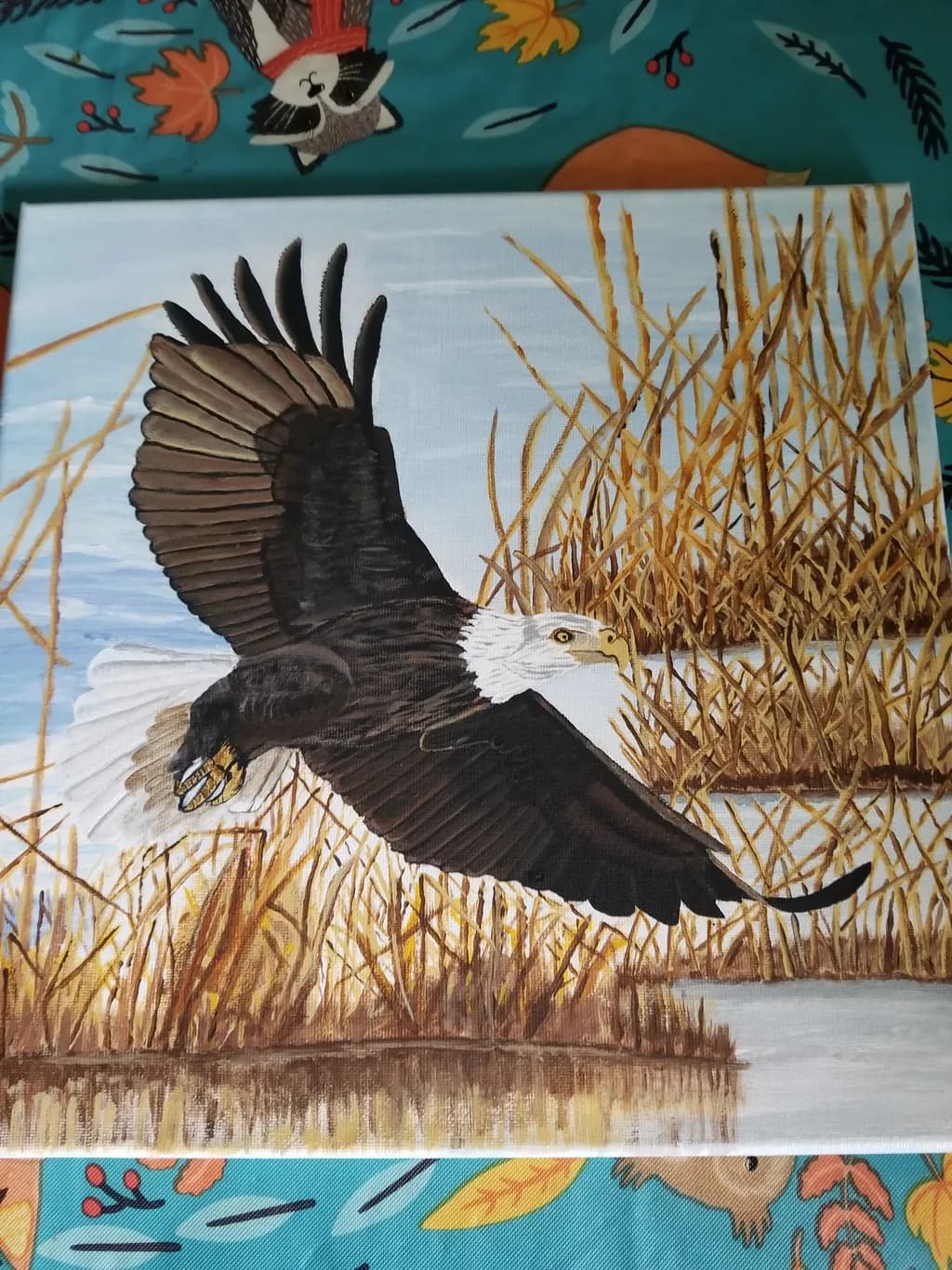 Eagle in Flight Over Reeds