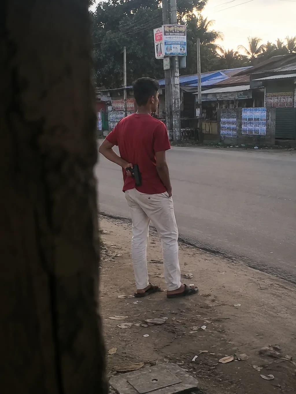 Man on Street with Gun