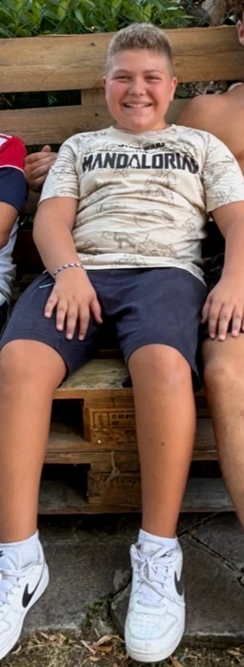 Smiling Child on a Bench