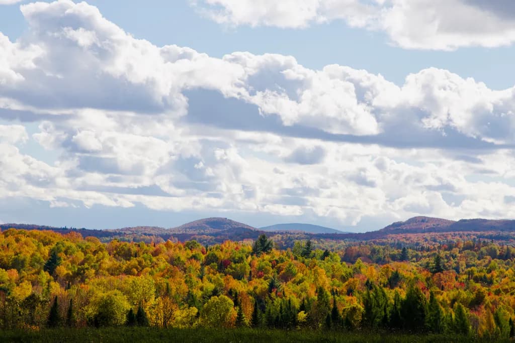 Autumn Hills Under Clouds