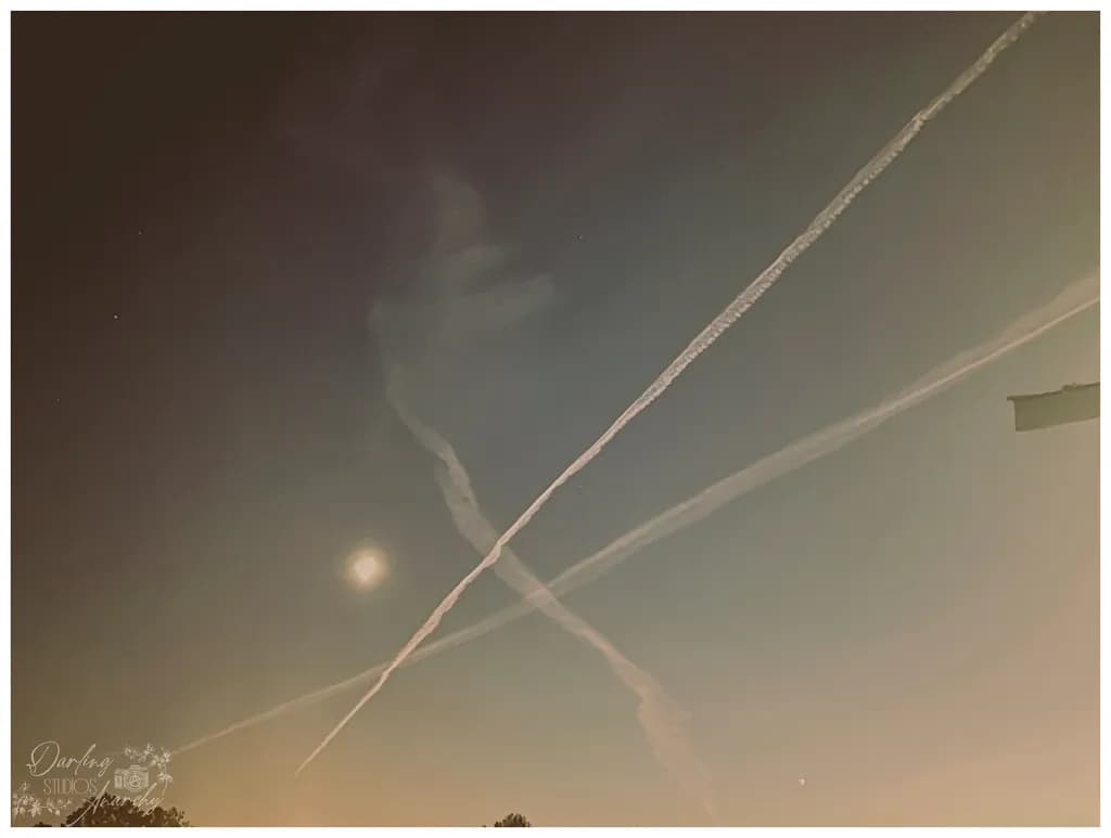 Crossing Contrails at Moonrise