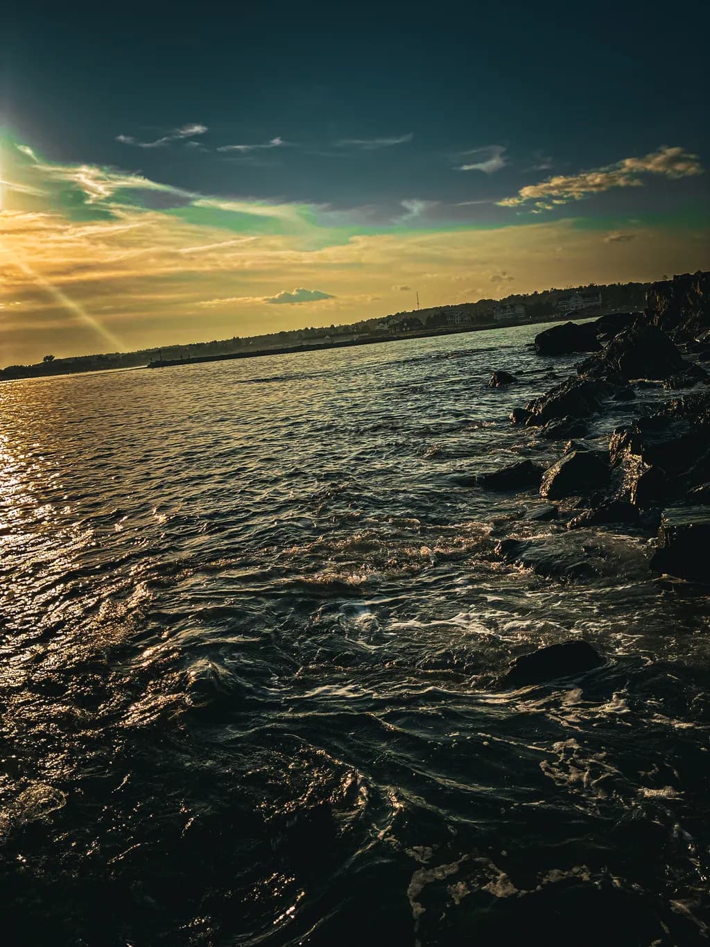 Sunset Over Rocky Shoreline