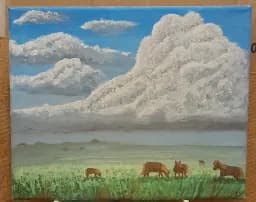 Dartmoor Ponies Beneath Towering Clouds