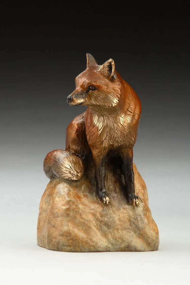 Whispers of the Wild: A Captivating Fox Sculpture in Natural Elegance