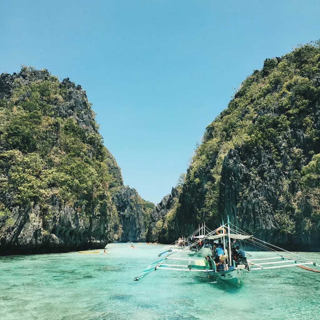 Serenity in Motion: A Tranquil Journey Through Coastal Waters and Majestic Rocks
